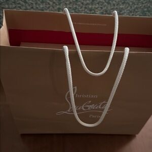 Christian Louboutin Tan Bag with White Handles used one time